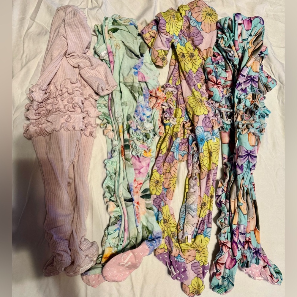Bundle of 4 New born ruffled posh peanut onsies!
